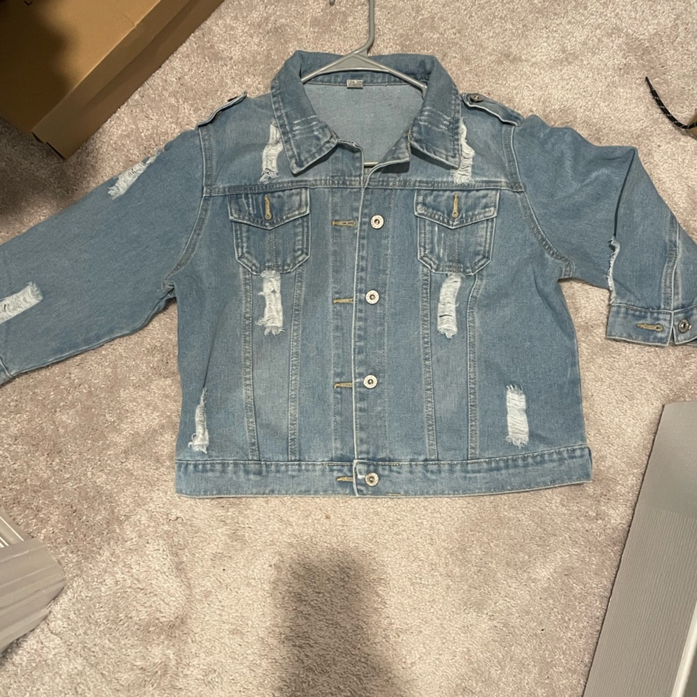 Size: Medium Denim Jean jacket. Elbow length sleeve. Never worn